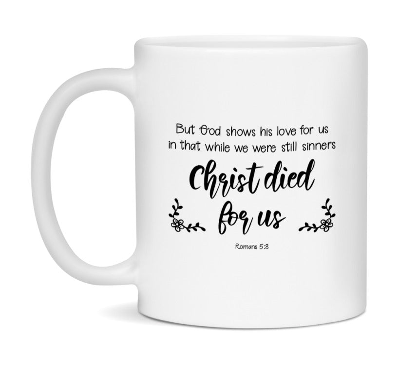 But God Shows His Love For Us In That While We Were Still Sinners Christ Died For Us Mug